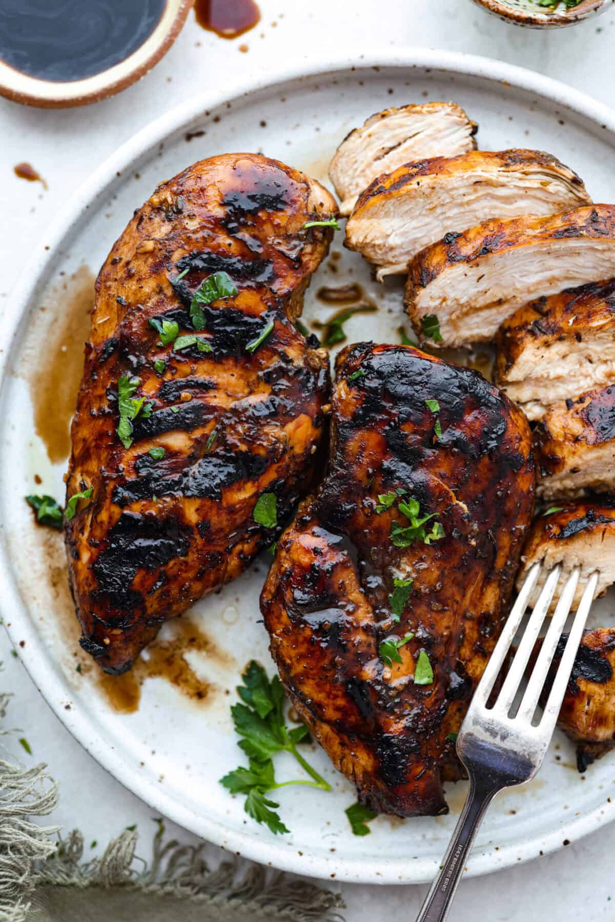 Overhead shot of grilled chicken that was cooked in balsamic chicken marinade.