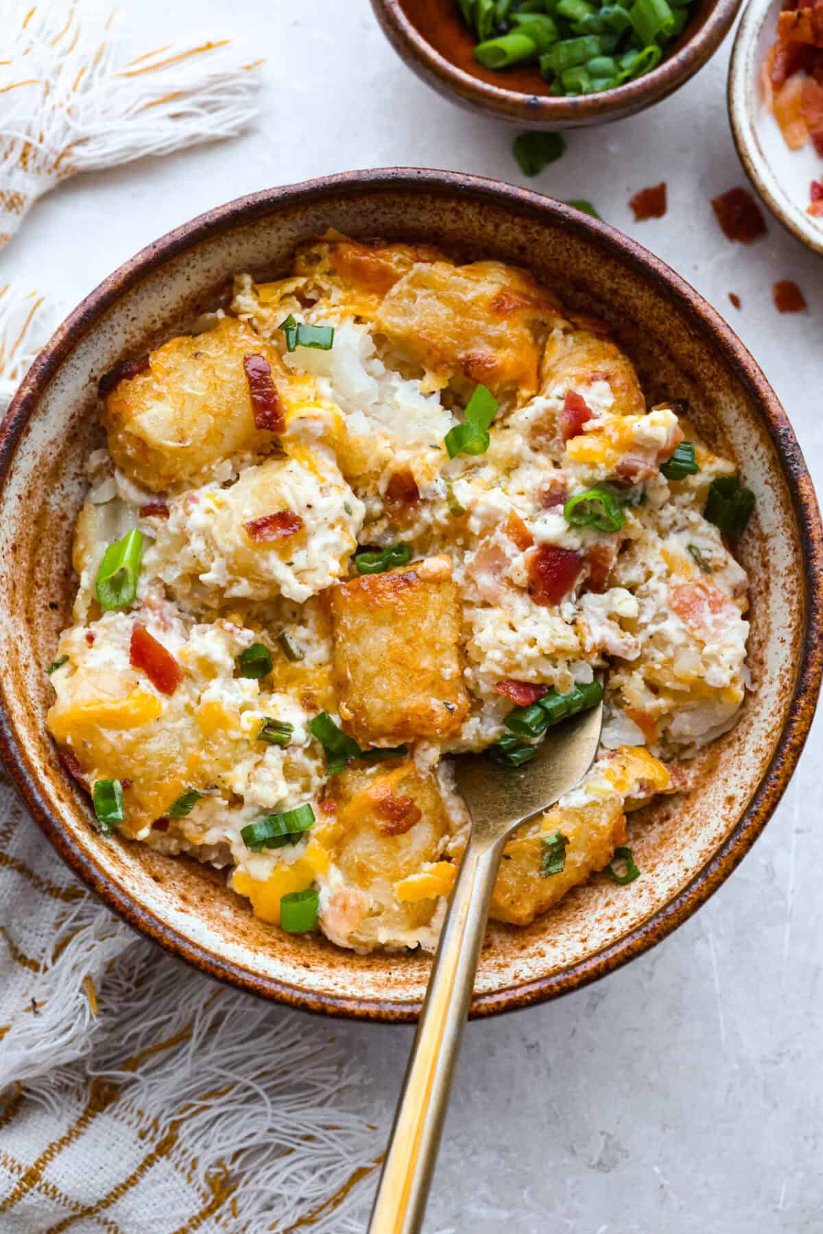 Serving portion of cracked out tater tot casserole.