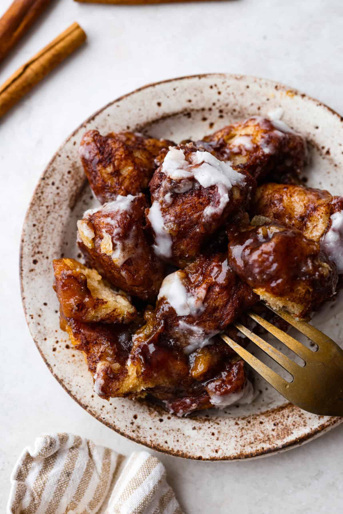 Overhead shot of plated crockpot monkey bread pieces on a plate. 