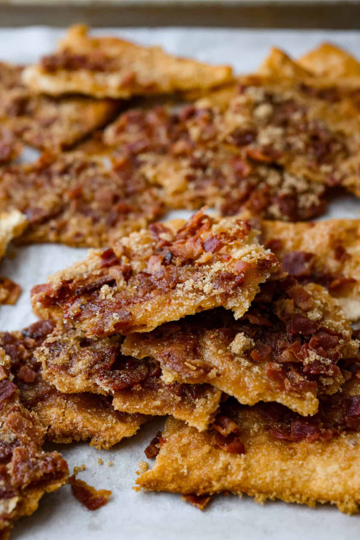 Angle shot of stacked pieces of maple bacon crack.