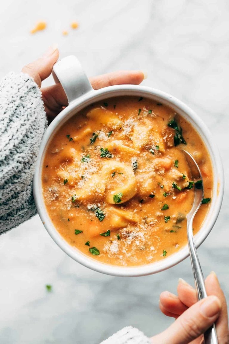 Tortellini soup in a bowl.