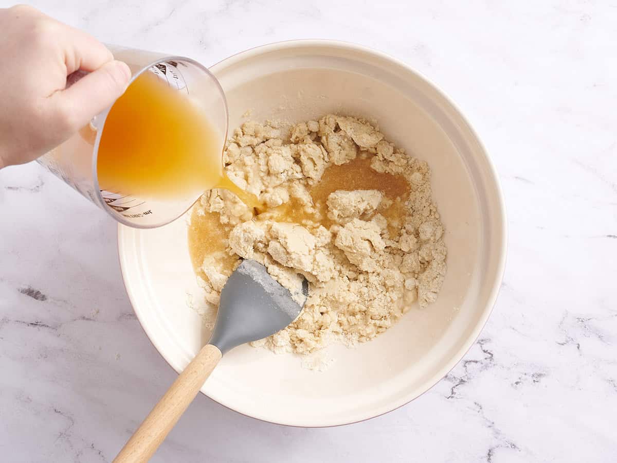 Broth added to a bowl to make tamales,