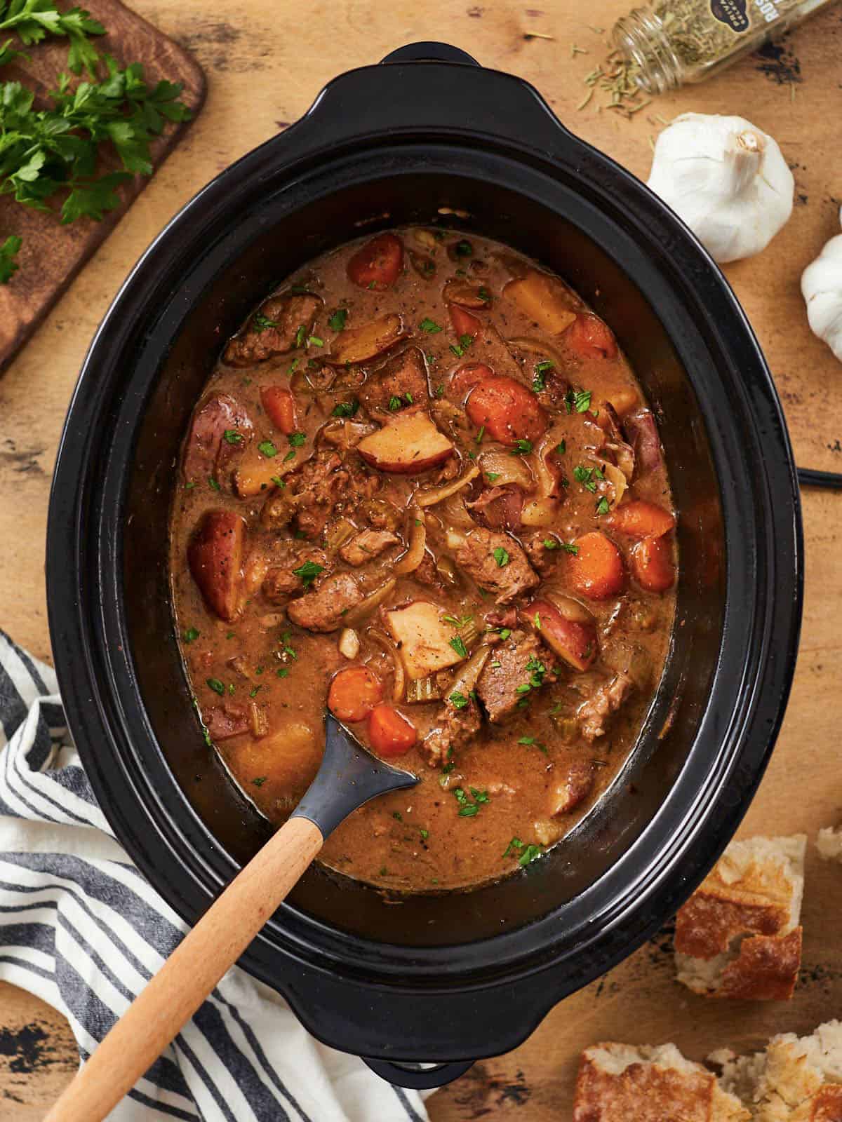 Overhead view of a beef stew in the slow cooker.