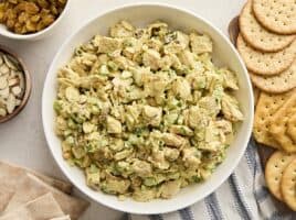 Overhead view of a bowl of chicken curry salad.