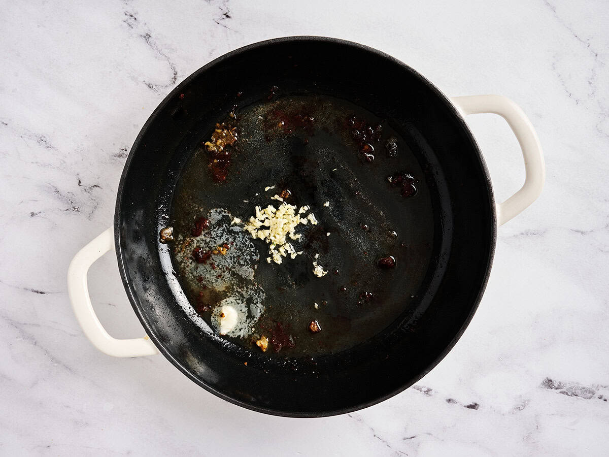 Butter and minced garlic in a skillet.