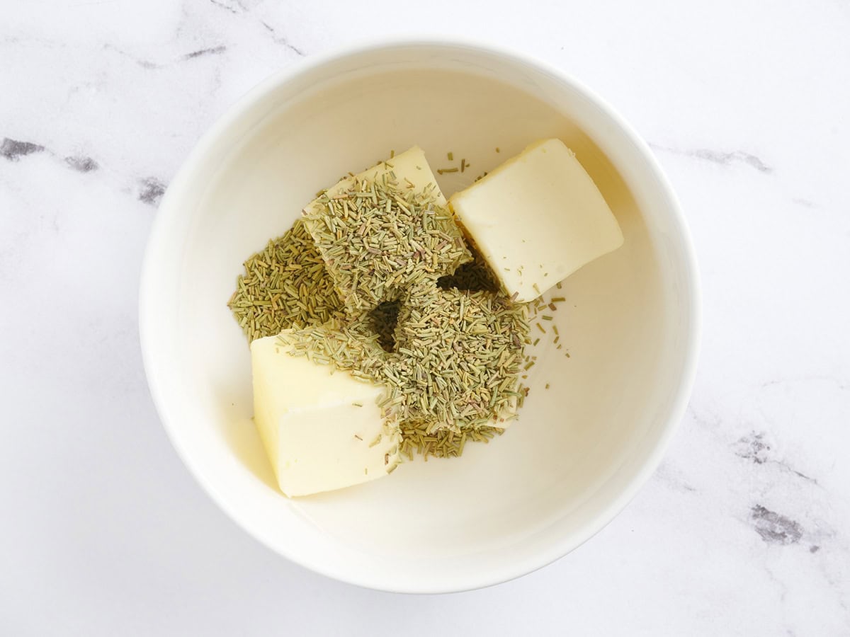 Butter and seasonings in a bowl.