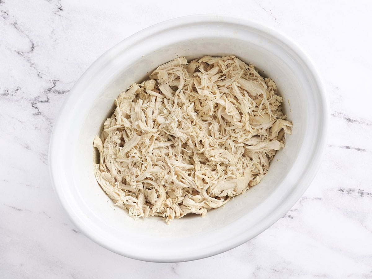 Shredded chicken in a crockpot.