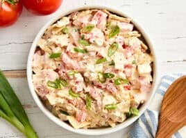 Overhead view of a bowl of tomato cracker salad.