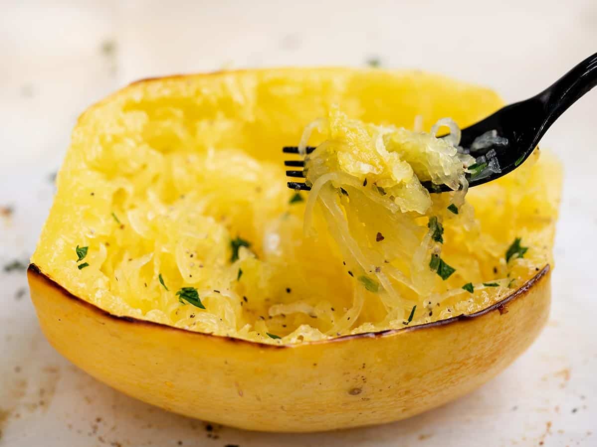 Roasted spaghetti squash on a plate.