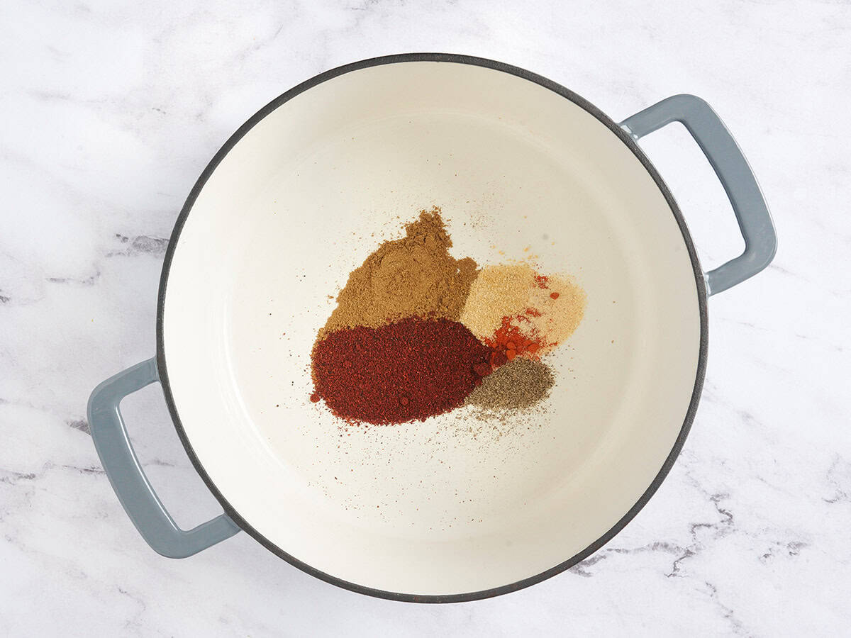 various spices being toasted to make 3-bean chili