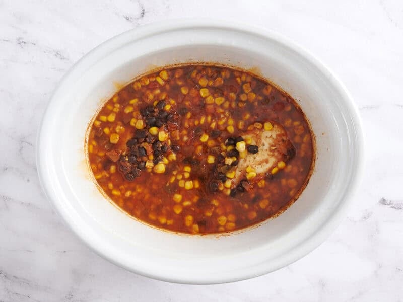 Cooked slow cooker chicken taco bowls.