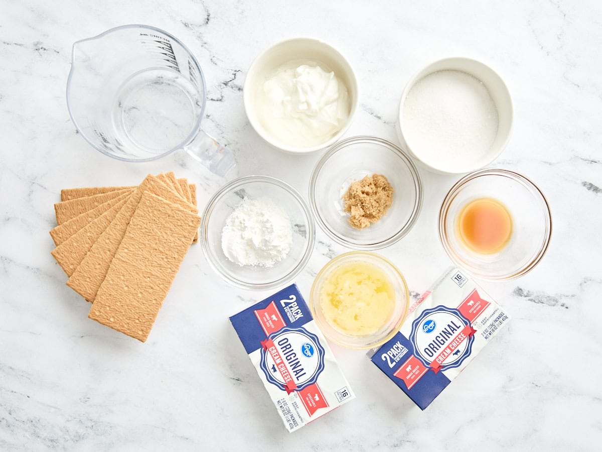 The ingredients to make homemade cheesecake bars.
