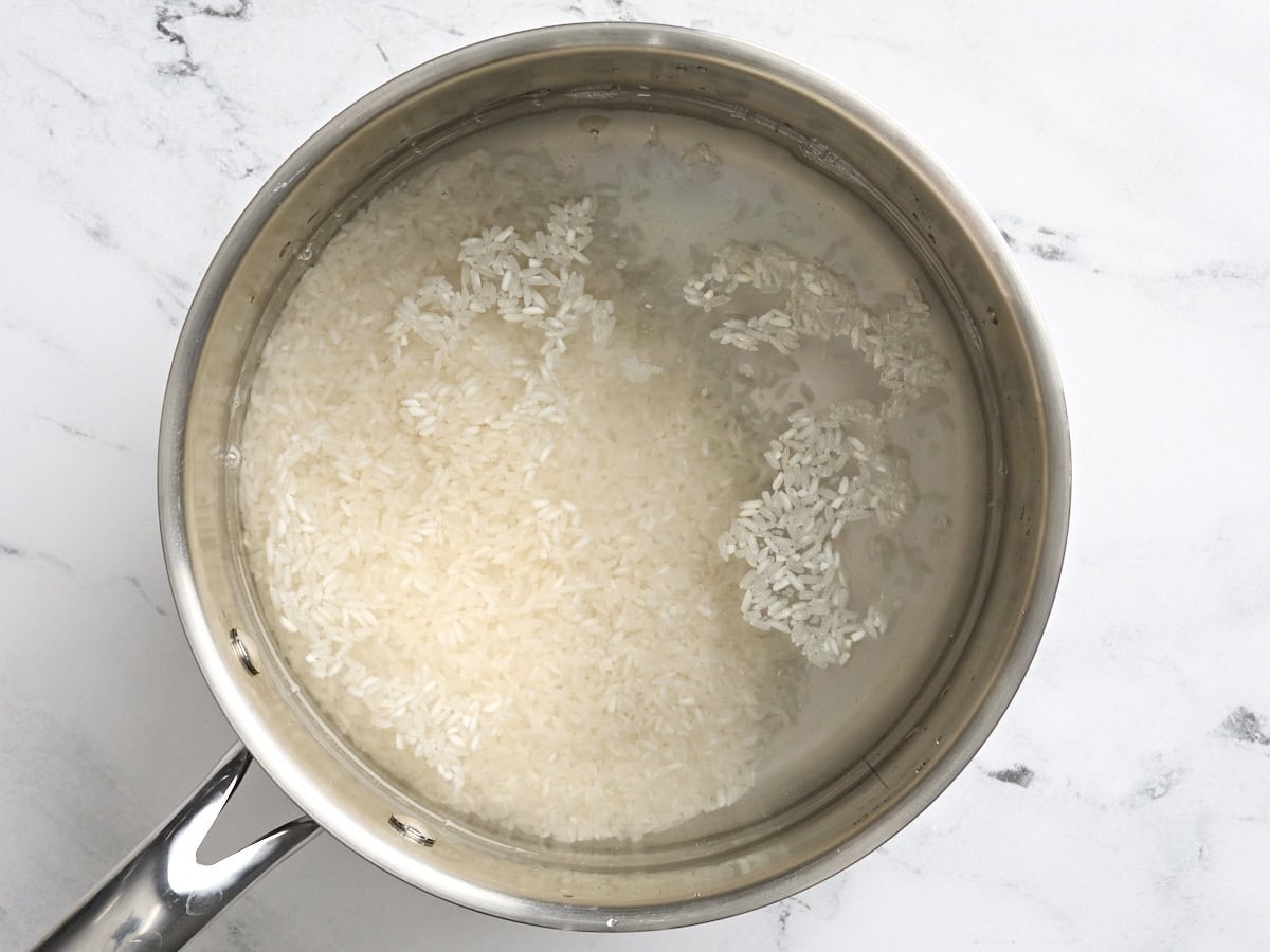 Rice cooking in a saucepan.