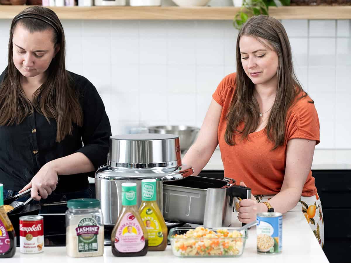 woman using an air fryer