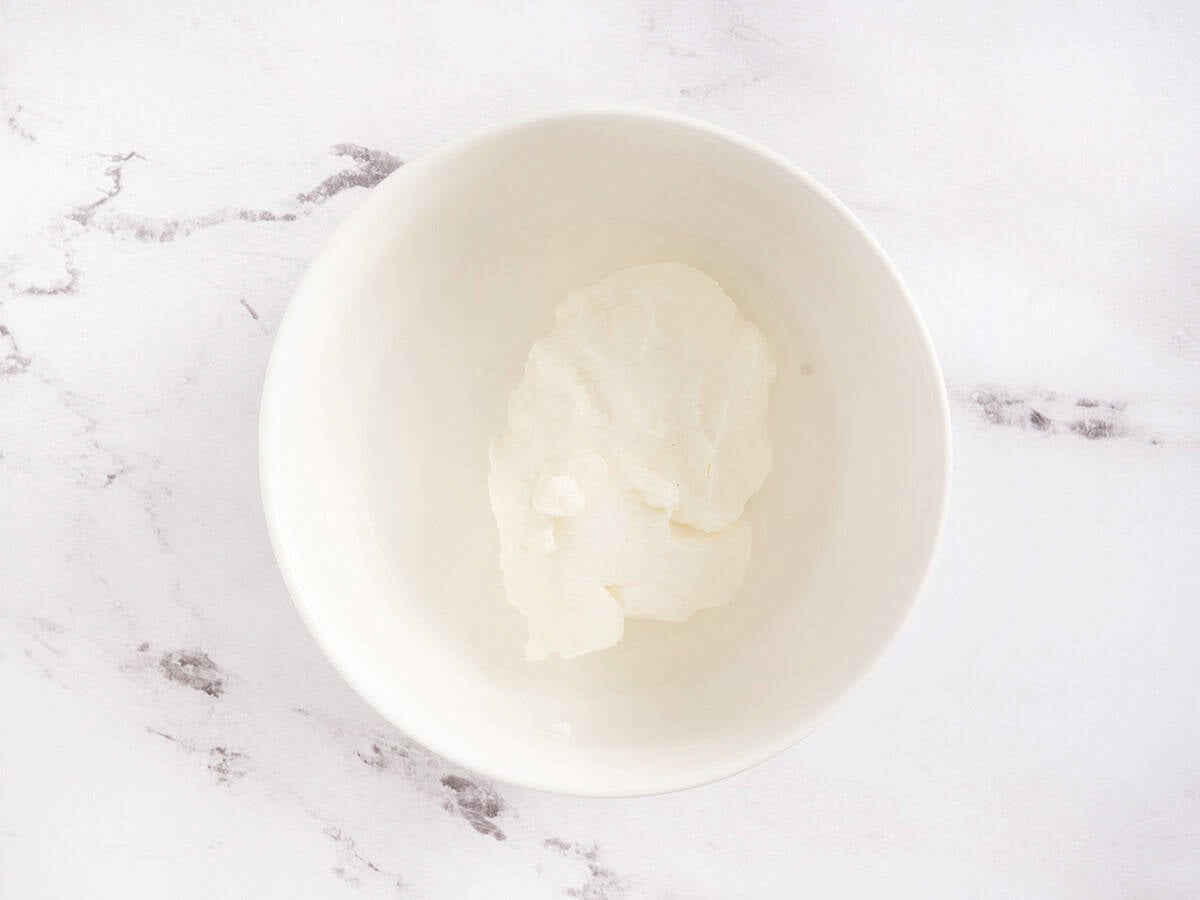 Yogurt, water and salt in a bowl.