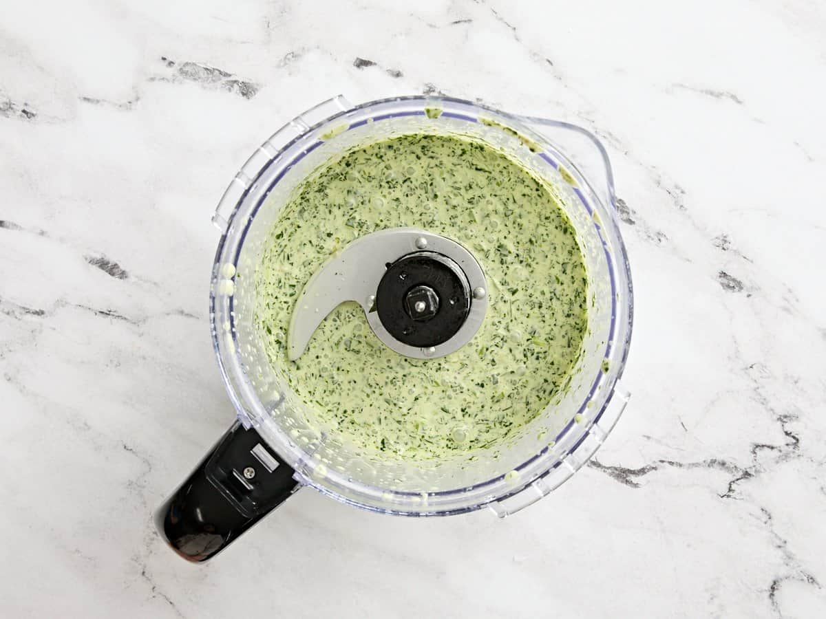 Green goddess dressing in a food processor.