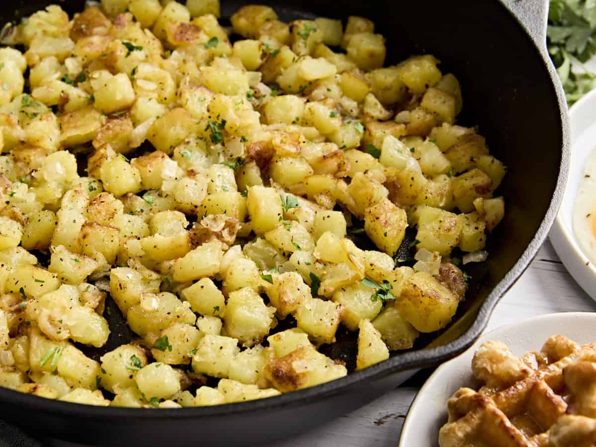 Side view close up of skillet breakfast potatoes.