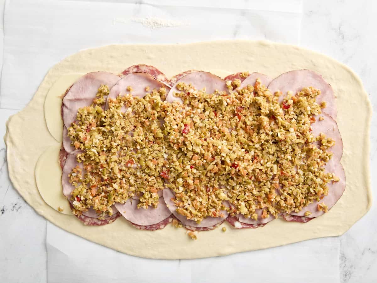 Fillings for muffaletta roll up on pizza dough