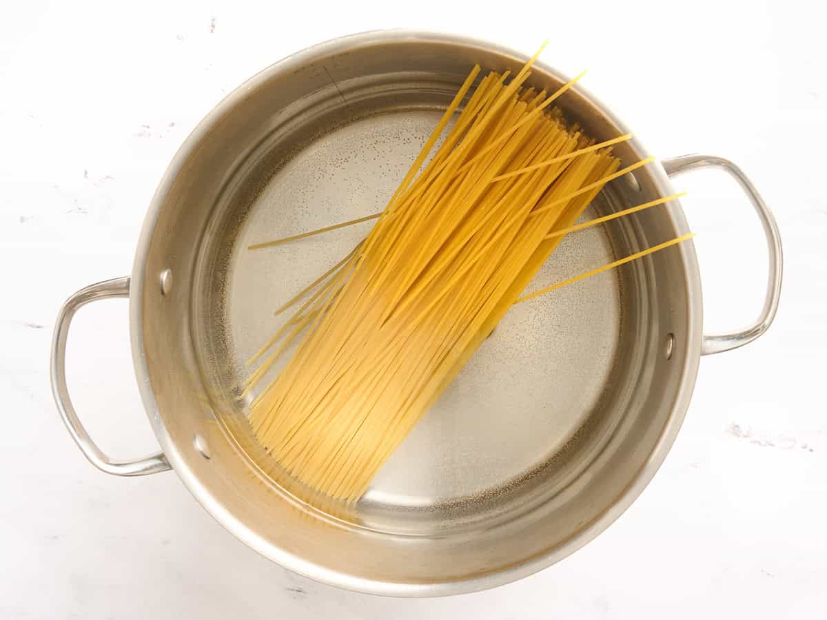 Spaghetti in a pot of water.