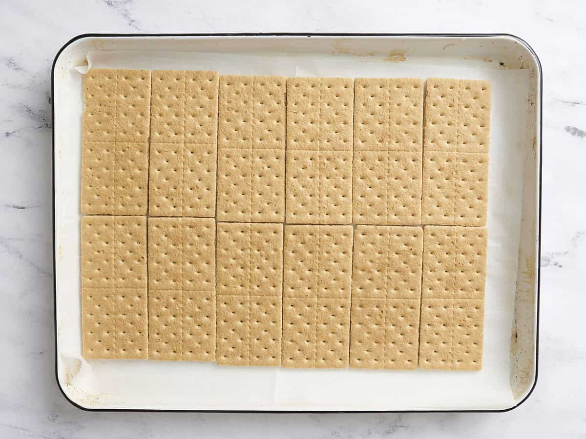 Graham crackers in the bottom of a pan.