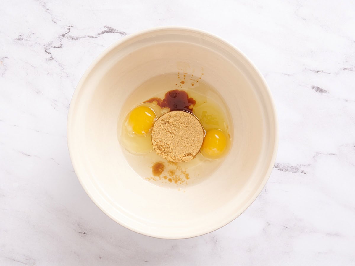 Sugar, oil and vanilla in a mixing bowl.