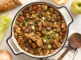 Overhead view of sausage stuffing in a casserole dish.