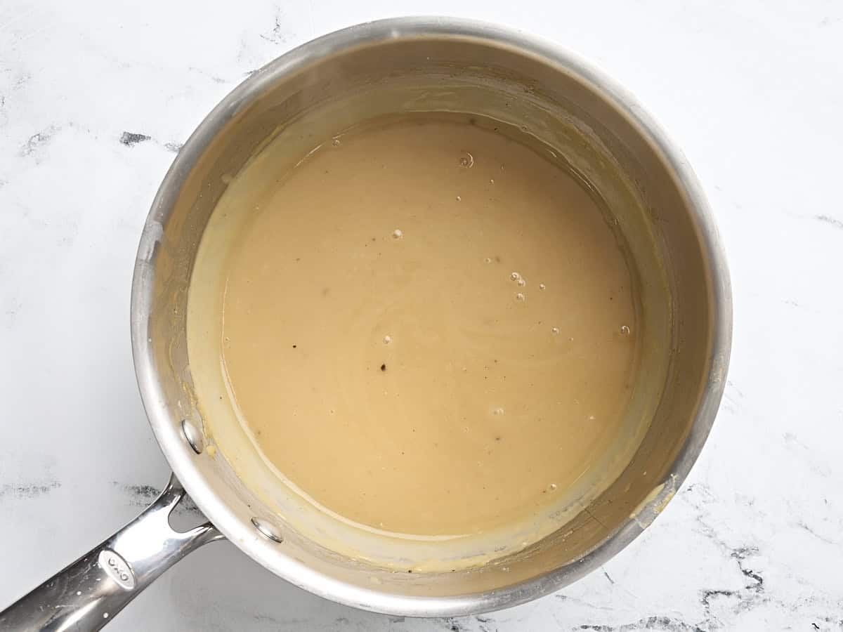 Finished turkey gravy in a sauce pan.