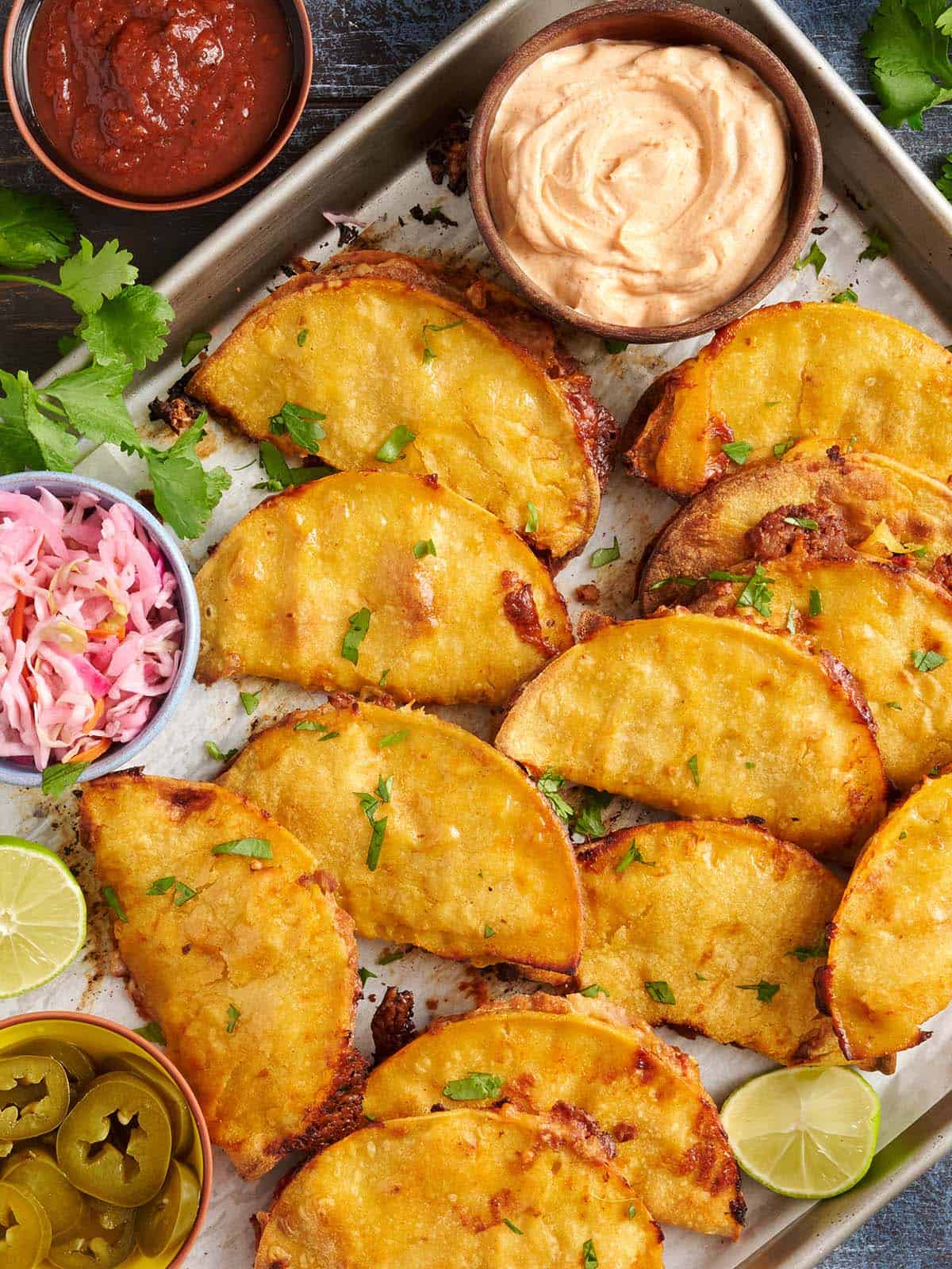 crispy baked tacos on a baking sheet