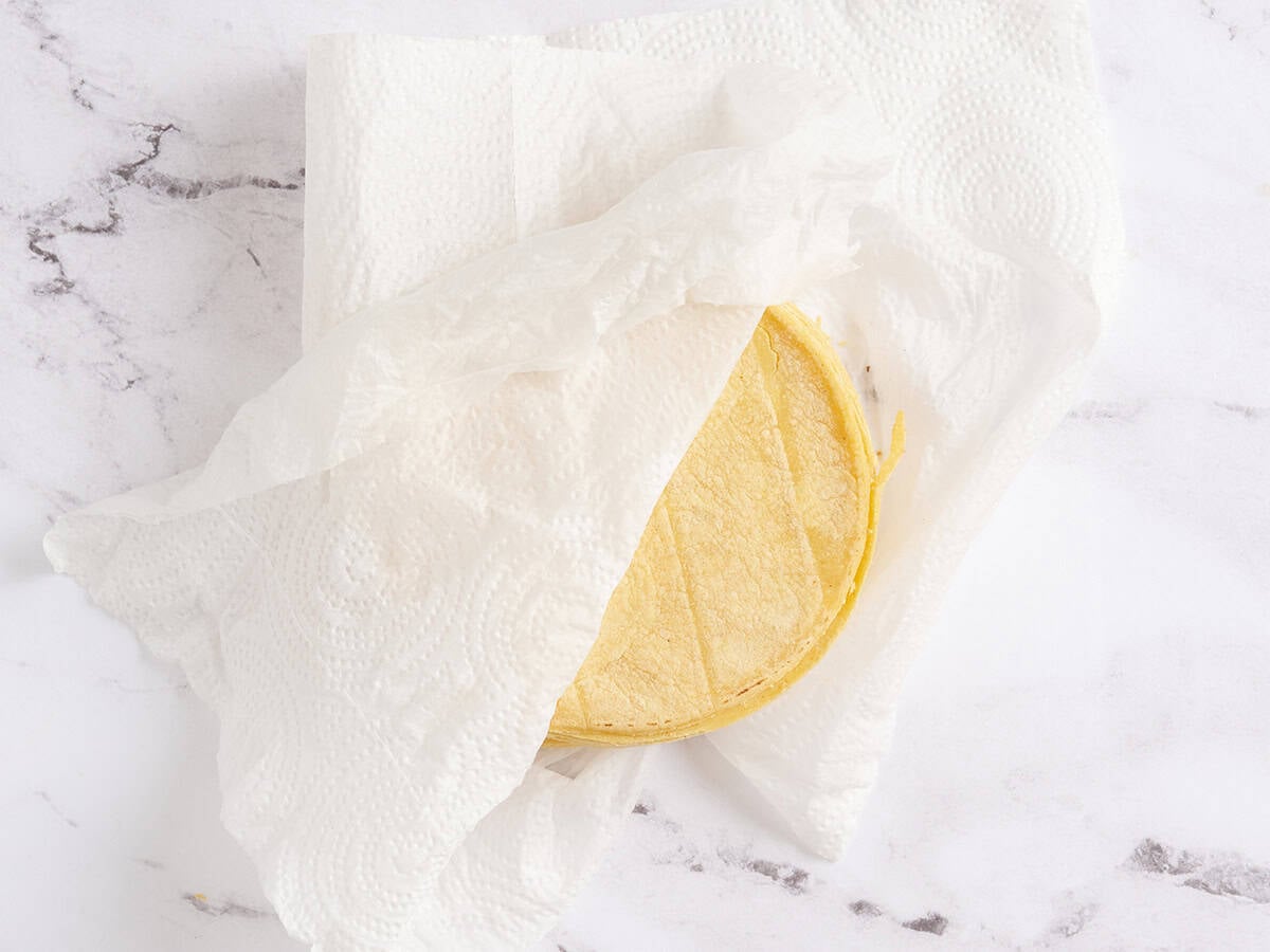 A damp paper towel wrapped around tortillas.