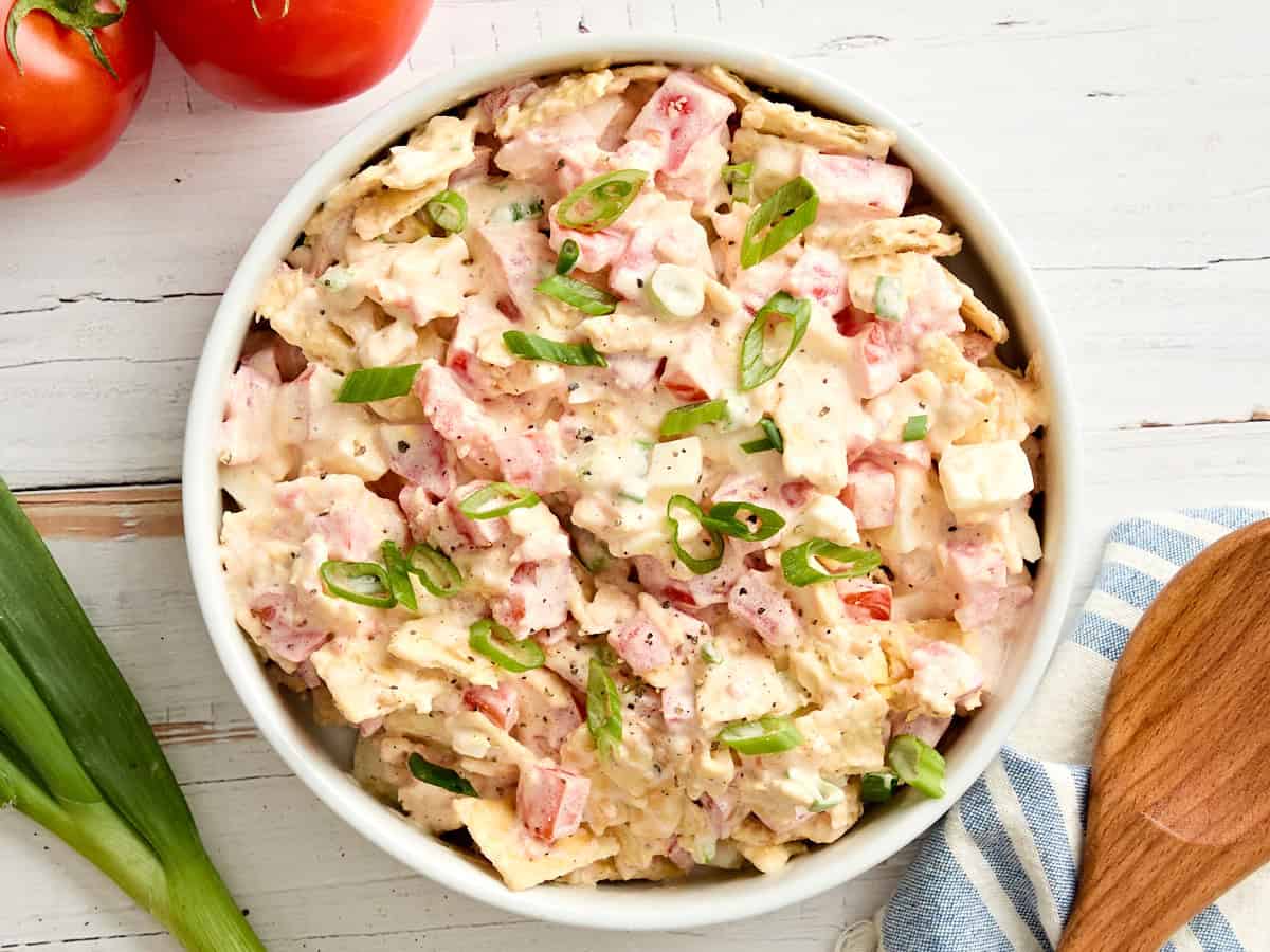 Overhead view of a bowl of tomato cracker salad.