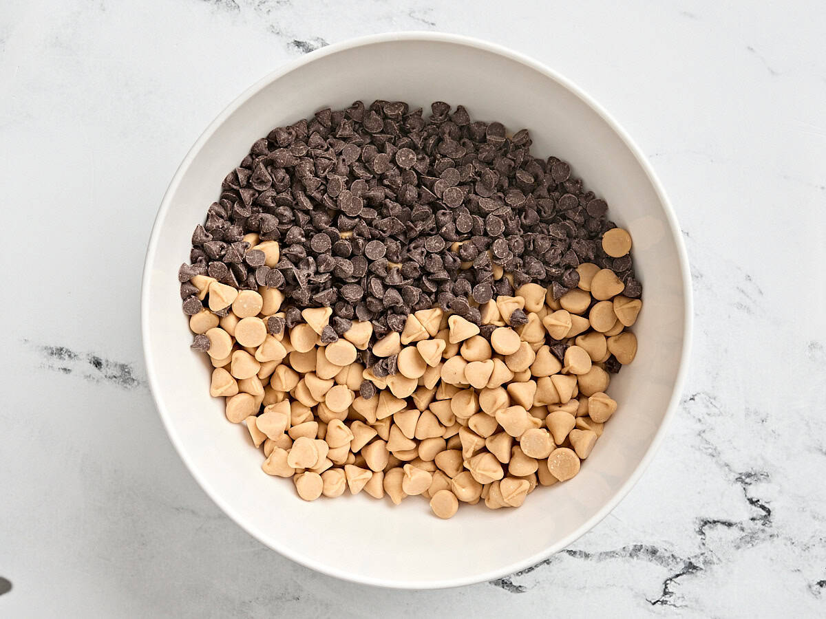 Semi sweet chocolate chips and butterscotch chocolate chips in a bowl.