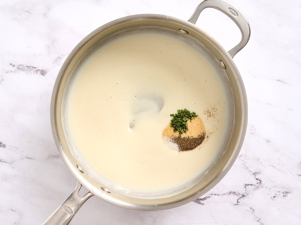 Seasonings added to a bechamel sauce.