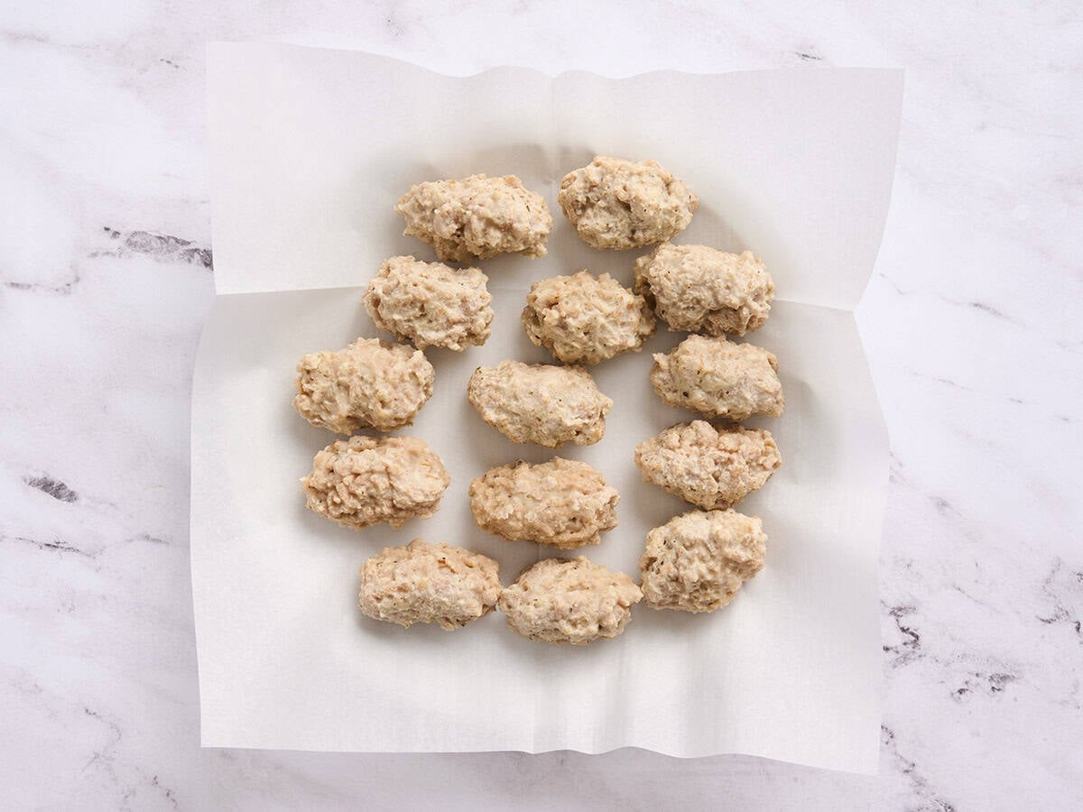 Frozen chicken croquettes on a plate.