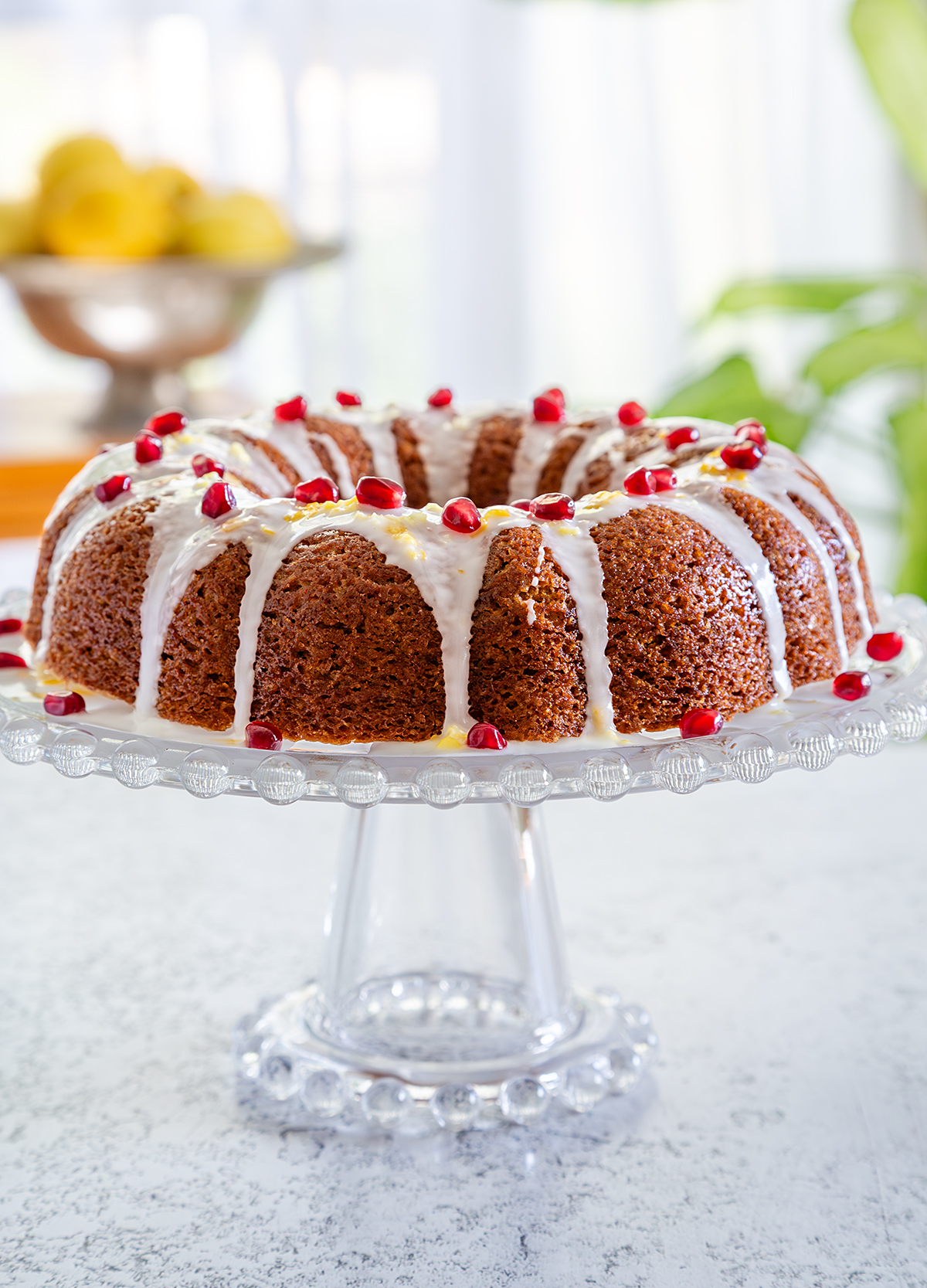 Oil-Free Vegan Lemon Drizzle Cake with Pomegranate Seeds