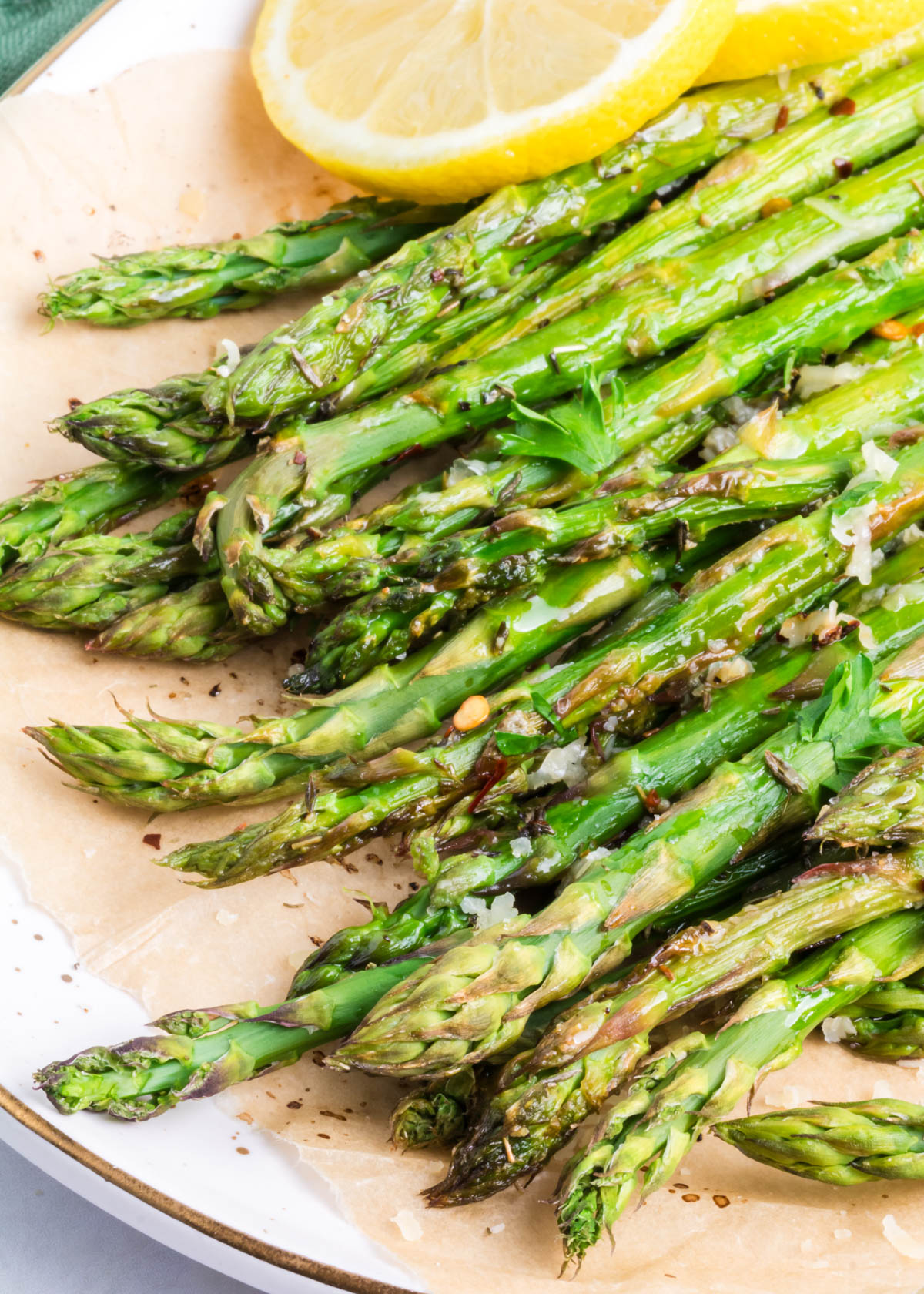 A close-up of the tips of parmesan roasted asparagus.