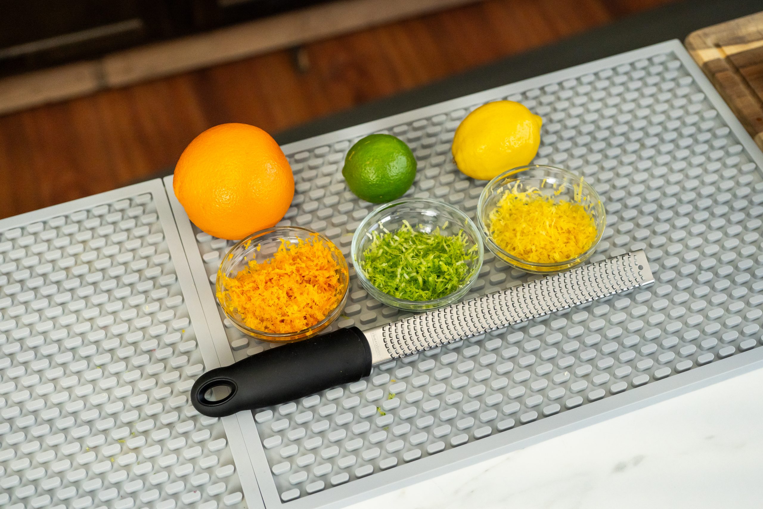 Citrus zester with zest from orange, lemon, and lime